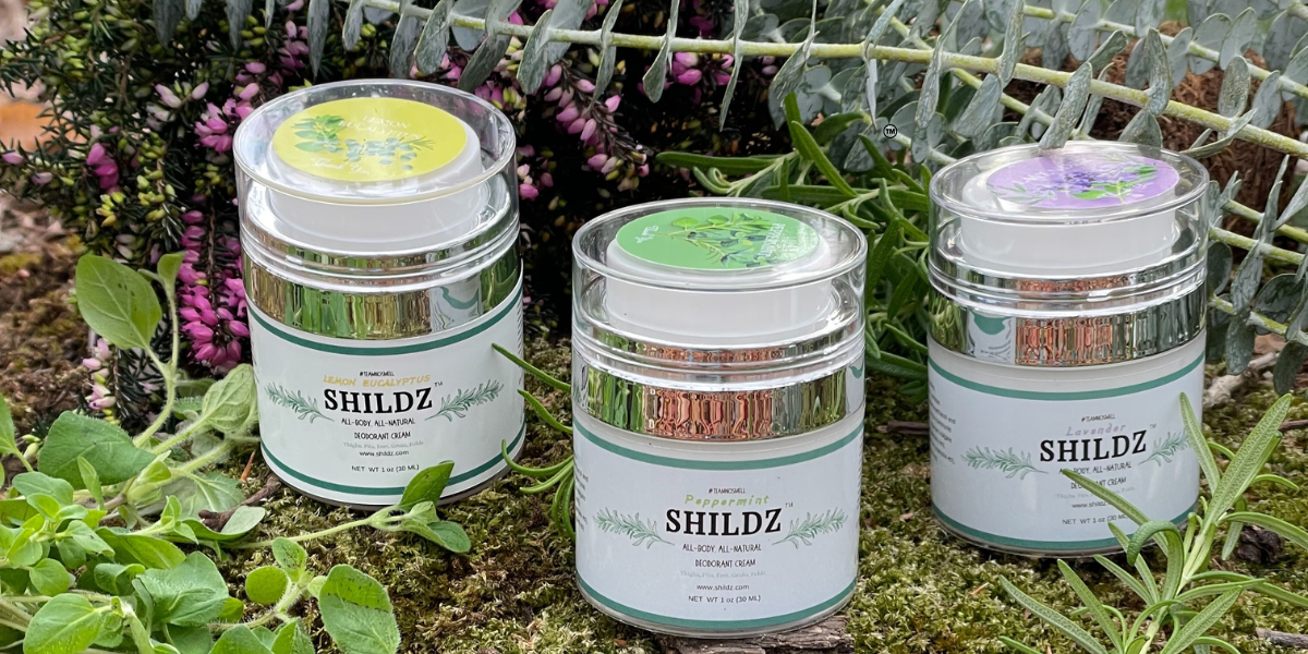 Three SHILDZ fragrances set in a natural background to emphasize the natural components. 